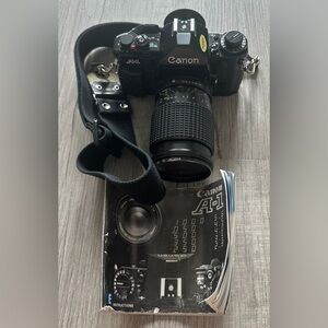 Canon A-1 Black SLR with Pamphlet and Strap